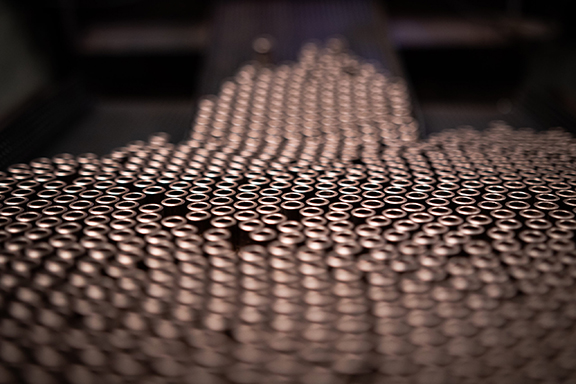 Large batch of bronze bearings coming off the compaction process.
