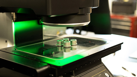 Powder metal iron parts under inspection.