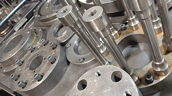 Powder metal tooling used in the compaction process.